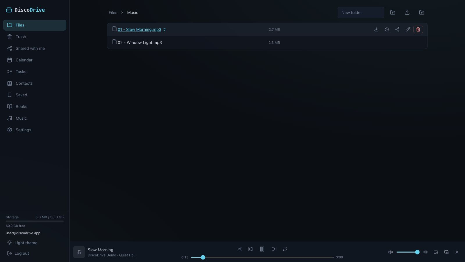 Music files in the DiscoDrive file list; the player bar with the playing track runs along the bottom of the window.